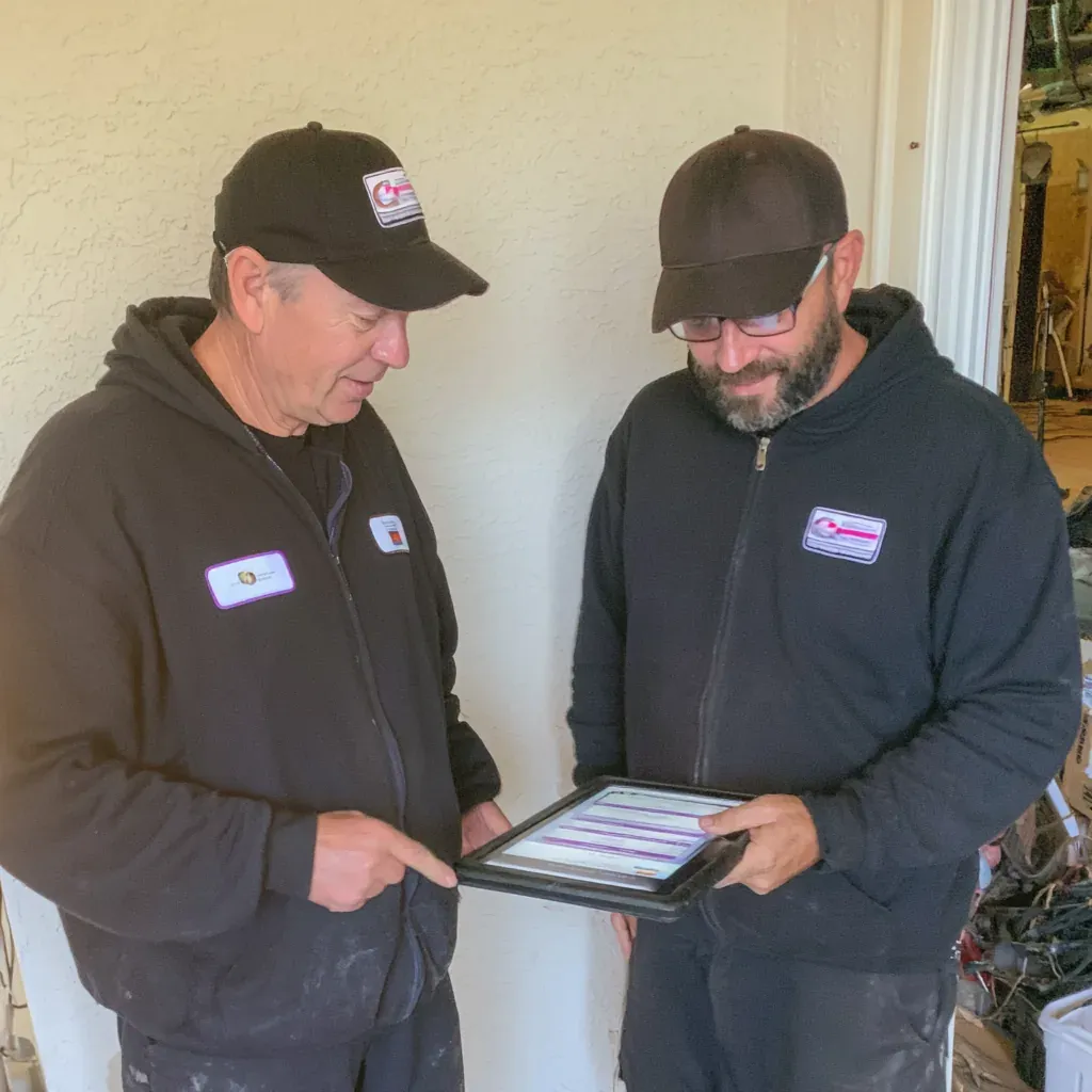 Oceanside garage door technician meeting homeowners